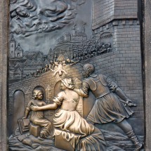 Bronze relief on Charles Bridge - touching it gives luck
